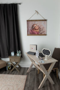 waiting room in Megan Dustin Photography studio with newborn artwork